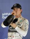 Mercedes driver Nico Rosberg celebrates on the podium after taking third place at the Bahrain Grand Prix on April 19, 2015