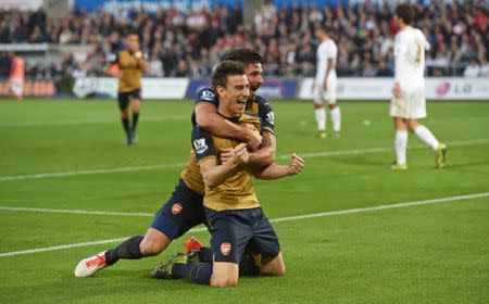 Football - Swansea City v Arsenal - Barclays Premier League - Liberty Stadium - 31/10/15 Arsenal's Laurent Koscielny celebrates with Olivier Giroud after scoring their second goal Action Images via Reuters / Alan Walter