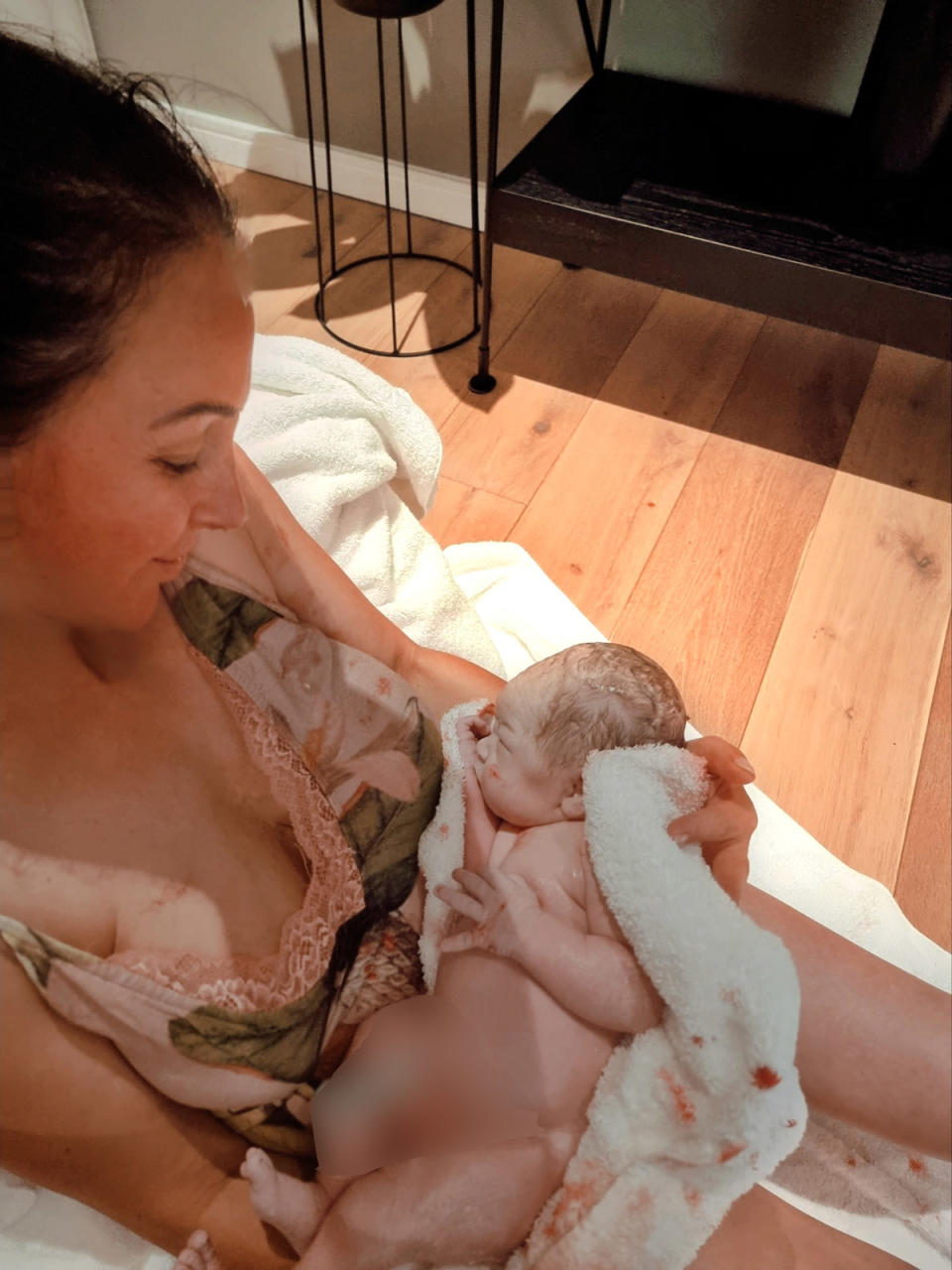 Inessa Amber, 42, pictured with her baby Elyanna just after giving birth. (Inessa Amber/SWNS)