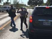 <p>FBI officials arrive at the site of a mass shooting in Sutherland Springs, Texas, Nov. 5, 2017, in this picture obtained via social media. (Max Massey/ KSAT 12/via Reuters) </p>