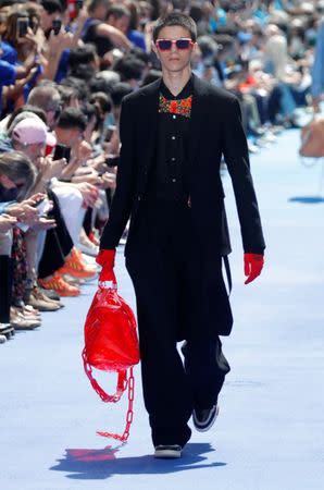 A model presents a creation by designer Virgil Abloh as part of his Spring/Summer 2019 collection for Louis Vuitton fashion house during Men's Fashion Week in Paris, France, June 21, 2018. REUTERS/Charles Platiau