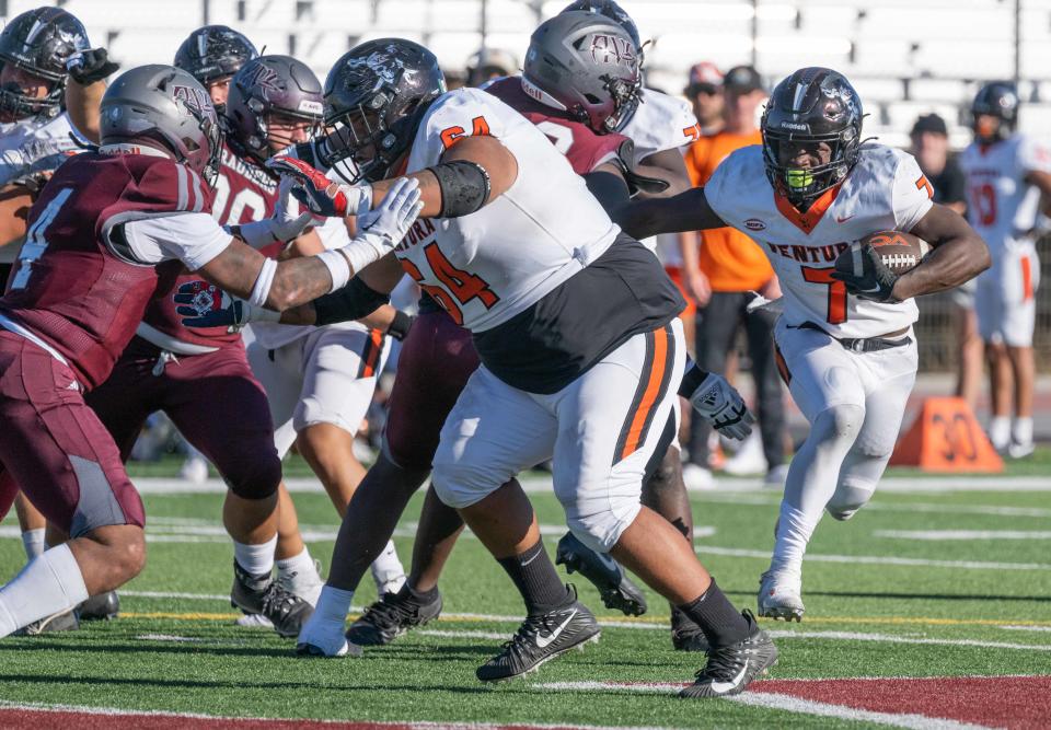 Ventura College running back Lamonte James runs off tackle as lineman Julio Rey paves the way during the Pirates' 35-16 win over Antelope Valley College on Oct. 21.