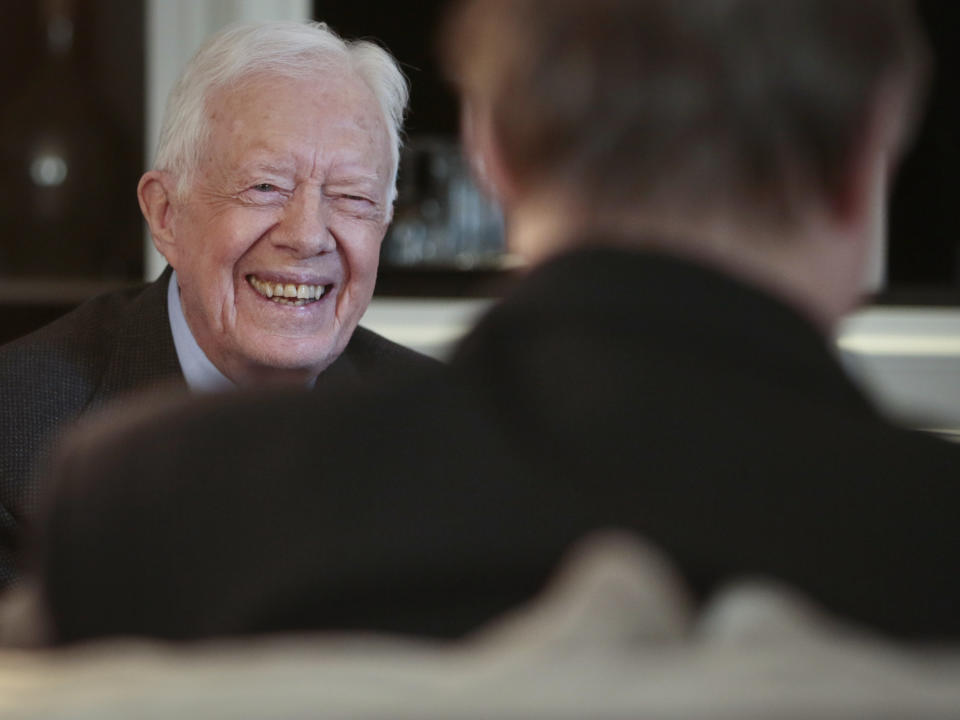 Former U.S. President Jimmy Carter laughs during an interview on Monday March 24, 2014 in New York. Carter said Monday that he doesn't support the Palestinian-led "boycott, divest, sanction" campaign against Israel but said products made in Israel-occupied Palestinian territories should be clearly labeled so buyers can make a choice about them. (AP Photo/Bebeto Matthews)