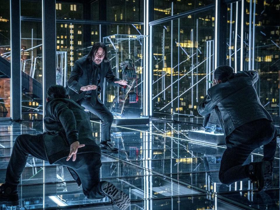 Keanu Reeves as John Wick facing Yayan Ruhian and Cecep Arif Rahman.