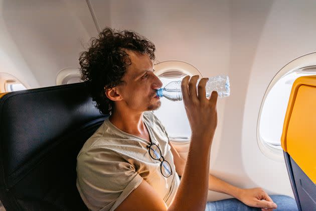 Avoiding caffeine and alcohol and opting for water on your flight will help you stay hydrated.