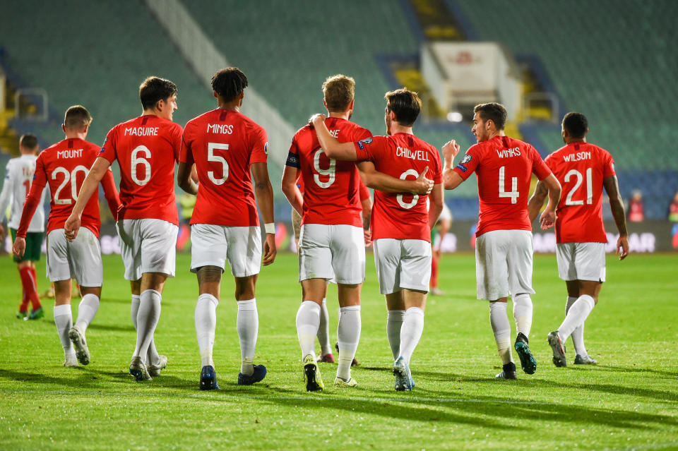 England's forward Harry Kane (C) celebrates with his teammates after scoring a goal during the Euro 2020 Group A football qualification match between Bulgaria and England due to incidents with fans, at the Vasil Levski National Stadium in Sofia on October 14, 2019. (Photo by NIKOLAY DOYCHINOV / AFP) (Photo by NIKOLAY DOYCHINOV/AFP via Getty Images)