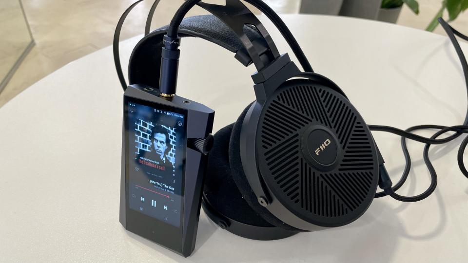 Astell & Kern A&norma SR35 and FiiO FT5 on a white table