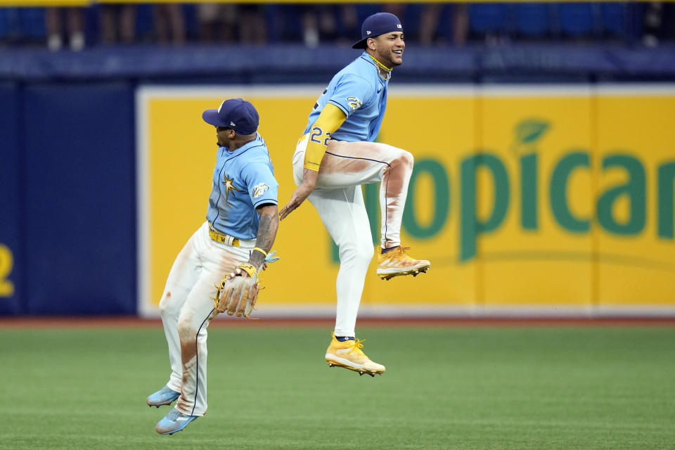 Tampa Bay Rays shortstop Wander Franco, left, and center fielder Jose Siri celebrate after the team defeated the Los Angeles Dodgers during a baseball game Sunday, May 28, 2023, in St. Petersburg, Fla. (AP Photo/Chris O'Meara)