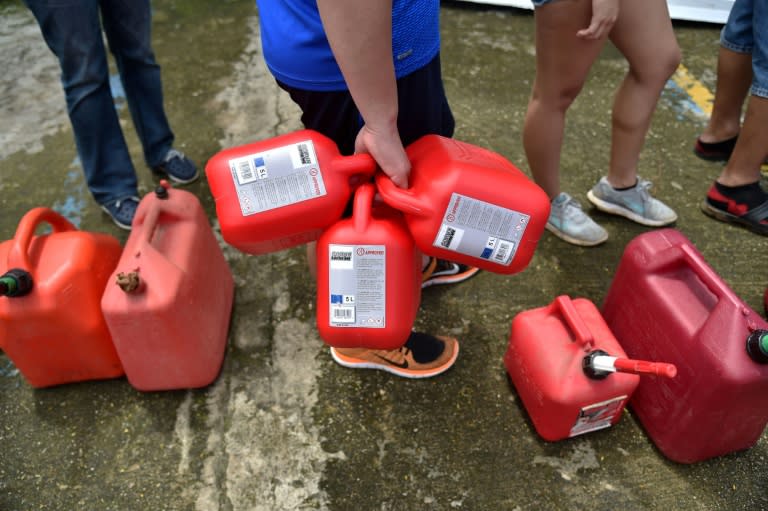 People wait in a line to buy gas after the passage of Hurricane Maria in Arecibo, northwestern Puerto Rico