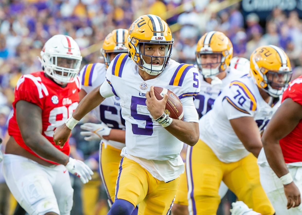 LSU quarterback Jayden Daniels scores a touchdown against Mississippi.