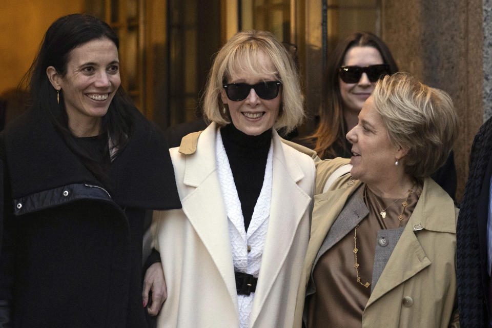 FILE — E. Jean Carroll, center, leaves Federal court, Friday, Jan 26, 2024, in New York. New York, whose current limited legal definition was a factor in writer E. Jean Carroll's sexual abuse and defamation case against former President Donald Trump, will expand its legal definition of rape to include various forms of nonconsensual sexual contact, under a bill signed into law by Gov. Kathy Hochul on Tuesday, Jan. 30, 2024. (AP Photo/Yuki Iwamura, File)