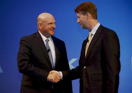 Microsoft CEO Steve Ballmer shakes hands with Nokia's Chairman of the Board Risto Siilasmaa (R) during the news conference of Finnish mobile phone manufacturer Nokia in Espoo, September 3, 2013. REUTERS/Sari Gustafsson/Lehtikuva