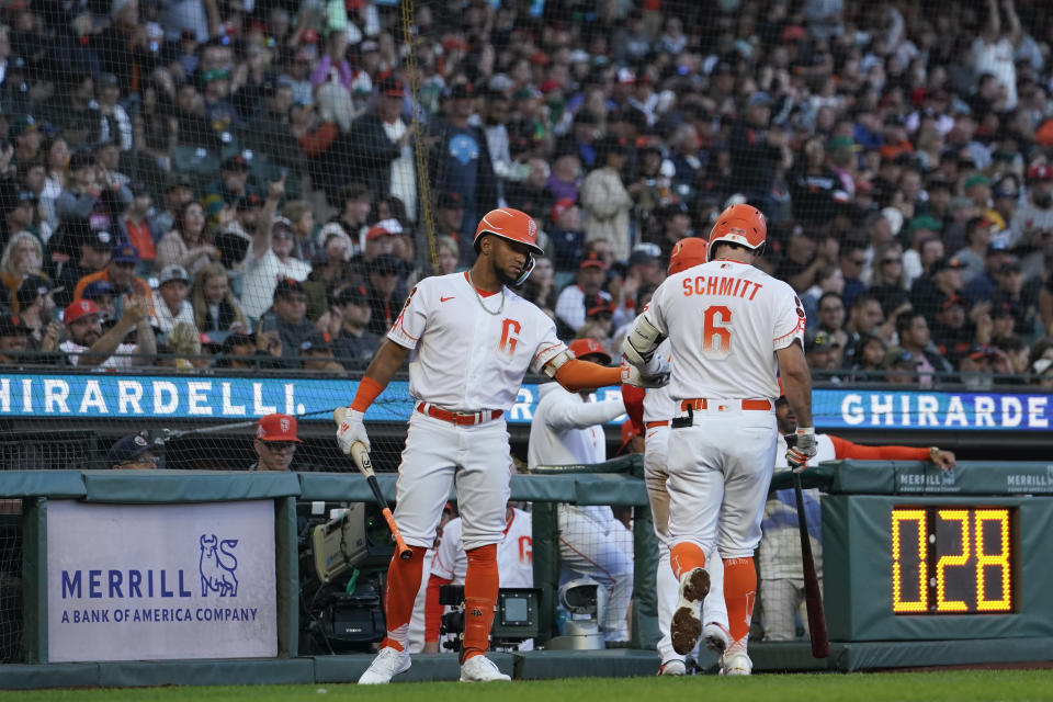 San Francisco Giants' Casey Schmitt (6) celebrates with teammates at the dugout after hitting a sacrifice fly against the Oakland Athletics during the fifth inning of a baseball game, Tuesday, July 25, 2023, in San Francisco. (AP Photo/Godofredo A. Vásquez)