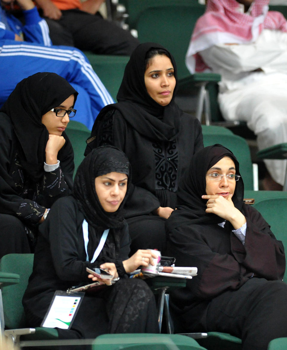 The Labor Ministry allows women to work in certain sectors without first obtaining their guardian's approval. Still, the decrees mandate that female workers not interact with men, reinforcing strict gender segregation, according to Human Rights Watch. Some private sector workplaces remain exempt from these decrees.  <em>Saudi female journalists attend a men's Asian Handball Championship match between Saudi Arabia and Qatar in Jeddah on January 31, 2012. Female journalists were recently allowed to cover sporting events despite strict segregation of the sexes outside the home that is enforced by the kingdom's powerful religious police which means that women are effectively barred from many jobs and social activities. (AMER HILABI/AFP/Getty Images)</em>