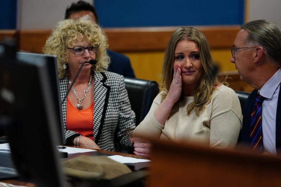 Jenna Ellis reacts after pleading guilty to a felony count of aiding and abetting false statements and writings, inside Fulton Superior Court Judge Scott McAfee’s courtroom on 24 October 2023 (via REUTERS)
