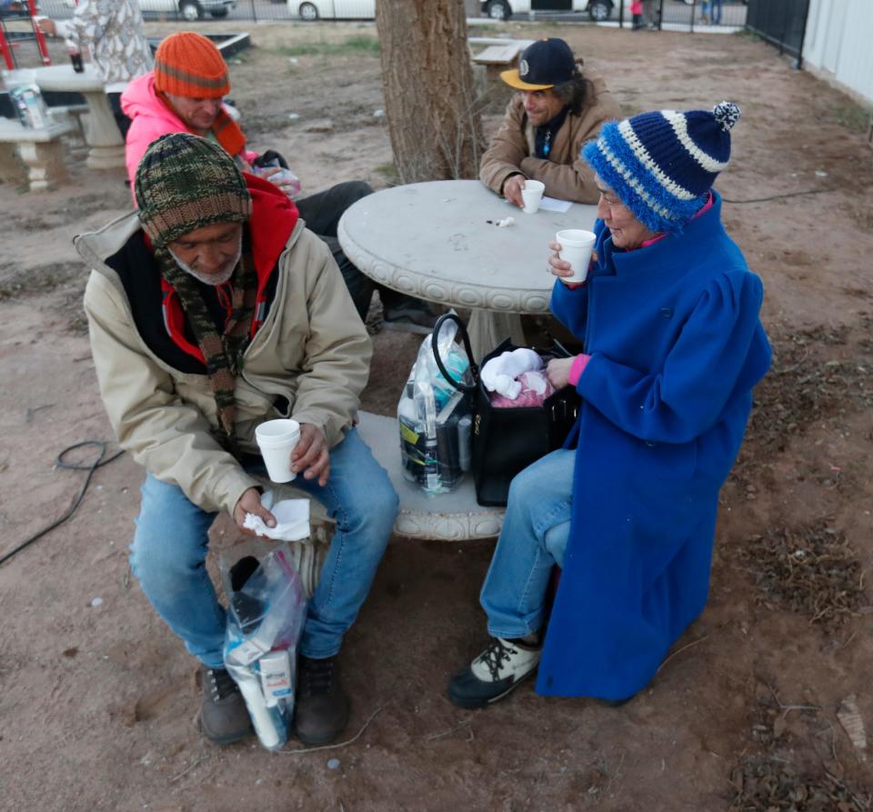 People eat treats and drink coffee during the event. Volunteers came out to give donated items and treats Wed, Dec. 21, 2022 at Dave Freriks Disaster Relief and Playground.