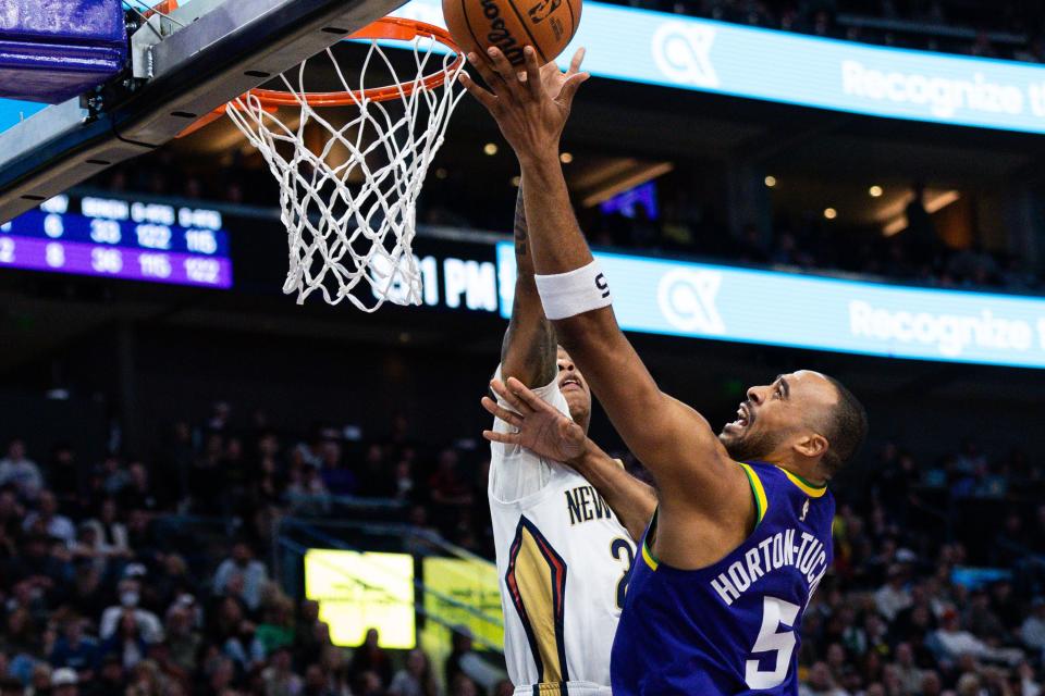 New Orleans Pelicans guard Jordan Hawkins (24) defends Utah Jazz guard Talen Horton-Tucker (5) while he tries to tip in the ball during an NBA basketball game between the Utah Jazz and the New Orleans Pelicans at the Delta Center in Salt Lake City on Monday, Nov. 27, 2023. | Megan Nielsen, Deseret News