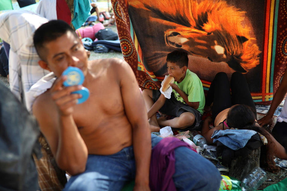 <p>A Central American migrant family from Honduras participating in the annual Migrant Stations of the Cross caravan or “Via crucis,” organized by the “Pueblo Sin Fronteras” activist group, rests at a sports center during the caravan’s few-days stop in Matias Romero, Oaxaca state, Mexico, Monday, April 2, 2018. (Photo: Felix Marquez/AP) </p>