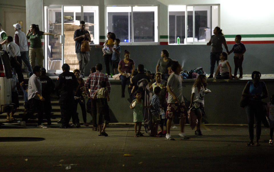 Migrants waits for their transfer from an immigration detention center in Tapachula, Chiapas state, Mexico, Thursday, April 25, 2019. A large group of mainly Cuban migrants escaped on foot from the immigration detention center on Mexico’s southern border in the largest mass escape in recent memory. Later, about half of the group returned voluntarily. (AP Photo/Moises Castillo)