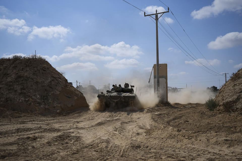 An Israeli tank moves near the Gaza Strip border in southern Israel, Thursday, April 11, 2024. (AP Photo/Tsafrir Abayov)