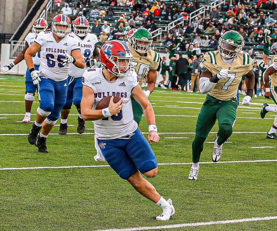 Louisiana Tech quarterback Landy Lyddy runs against Charlotte Saturday afternoon in Charlotte.