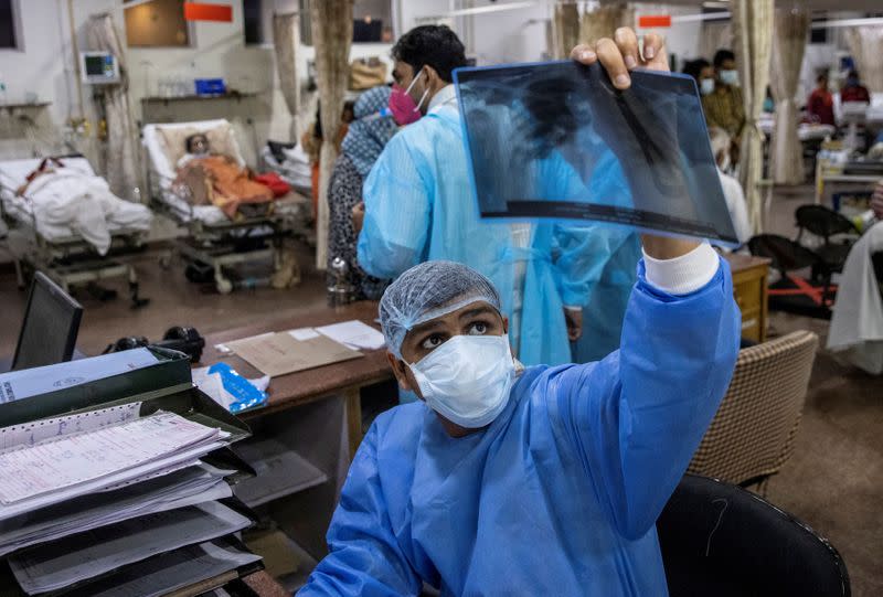 The Wider Image: As COVID ravages India, a 26-year-old doctor decides who lives and who dies