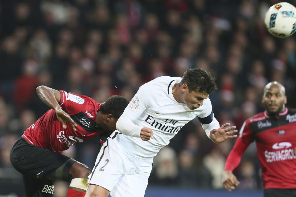 PSG's Thiago Silva, center, heads the ball during their League One soccer match against Guingamp, at the Roudourou stadium, in Guingamp, western France, Saturday, Dec. 17, 2016. (AP Photo/David Vincent)
