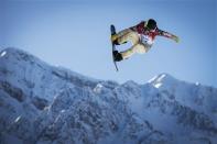 U.S. snowboarder Shaun White goes off a jump during snowboard slopestyle training at the 2014 Sochi Winter Olympics in Rosa Khutor February 4, 2014. REUTERS/Lucas Jackson