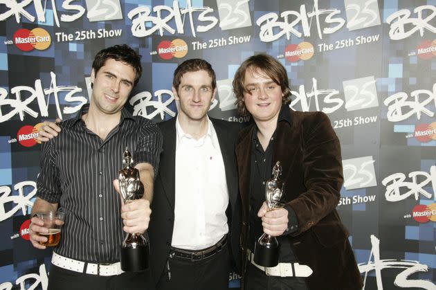 Tom with Kean bandmates Tim Rice-Oxley and Richard Huges at the 2005 Brit Awards (Photo: JMEnternational via Getty Images)