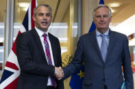 UK Brexit secretary Stephen Barclay, left, shakes hands with European Union chief Brexit negotiator Michel Barnier before their meeting at the European Commission headquarters in Brussels, Friday, Oct. 11, 2019. (AP Photo/Francisco Seco, Pool)