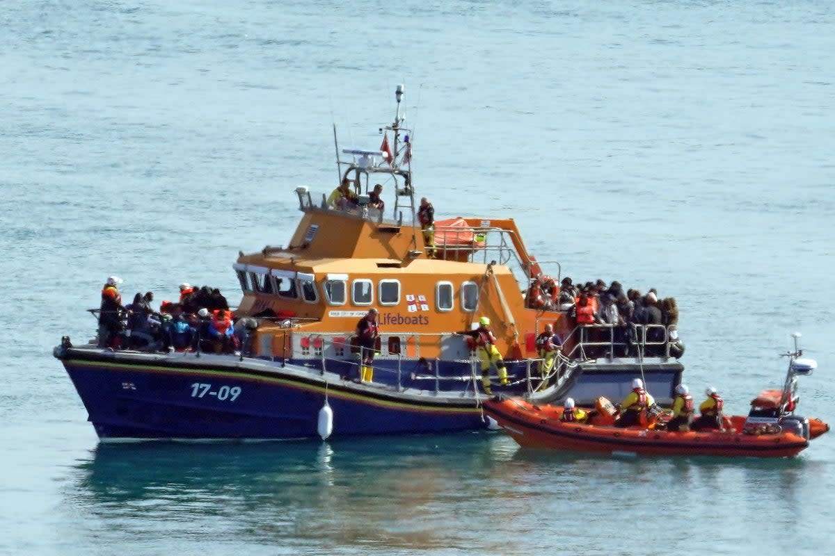 A group of people thought to be migrants are brought in to Dover, Kent, onboard the RNLI Dover Lifeboat following a small boat incident in the Channel (Gareth Fuller/PA) (PA Wire)