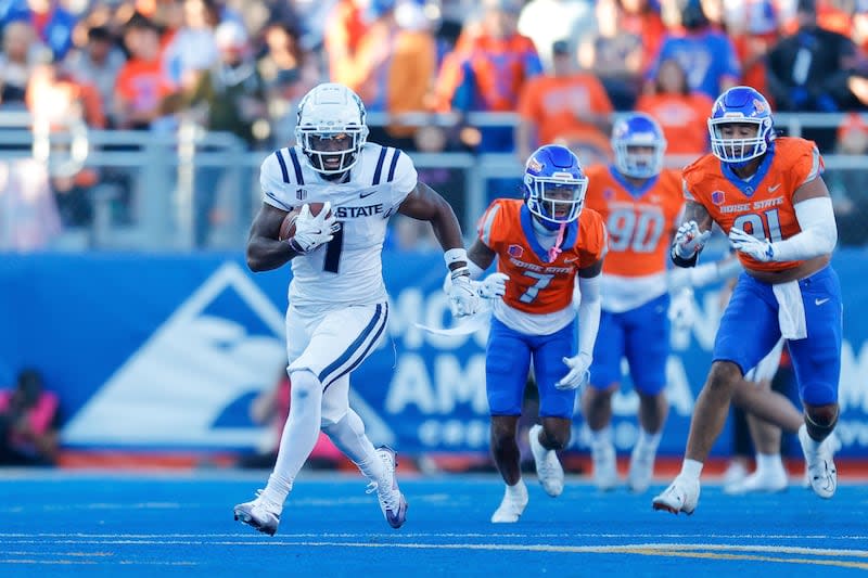 Utah State wide receiver Jalen Royals (1) turns up field after a reception against Boise State in the first half of an NCAA college football game, Saturday, Oct. 5, 2024, in Boise, Idaho. . (AP Photo/Steve Conner) | Steve Conner