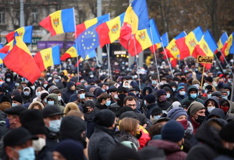 Supporters of Moldovan President-elect Maia Sandu attend a rally to demand the government to resign and to hold early parliamentary elections in Chisinau