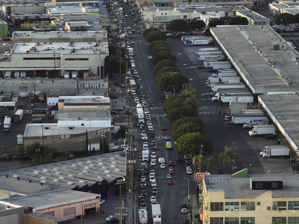 Traffic builds up near a section of Interstate 10 that has been closed due to a fire in Los Angeles, Tuesday, Nov. 14, 2023. It will take at least three weeks to repair the freeway damaged in an arson fire, the California governor said Tuesday, leaving the city already accustomed to soul-crushing traffic without part of a vital artery that serves hundreds of thousands of people daily. (AP Photo/Jae C. Hong)