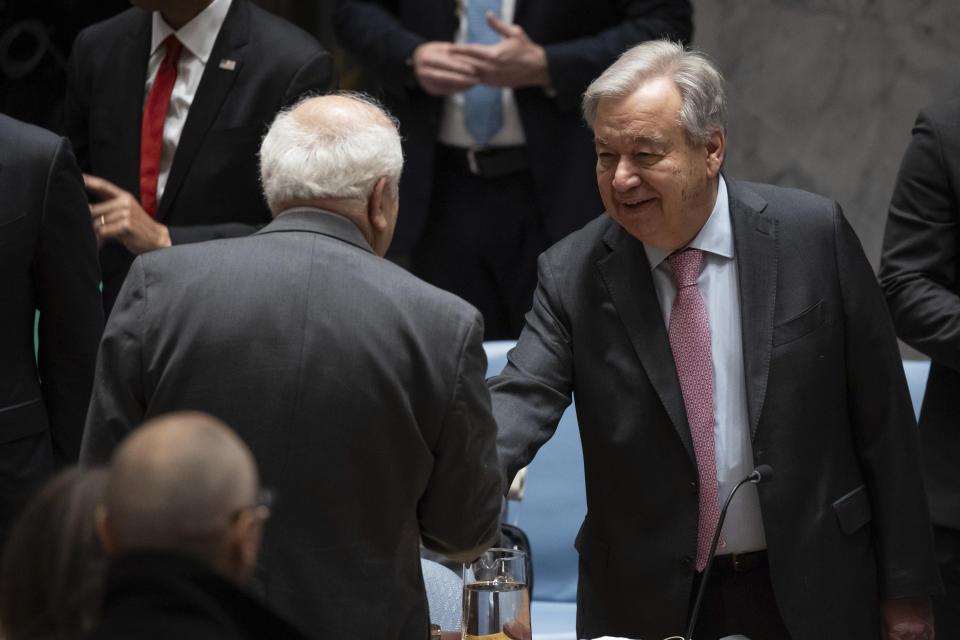 Palestinian Ambassador to the United Nations Riyad Mansour, left, and United Nations Secretary-General Antonio Guterres speak before a Security Council meeting at the United Nations headquarters, Thursday, April 18, 2024. (AP Photo/Yuki Iwamura)