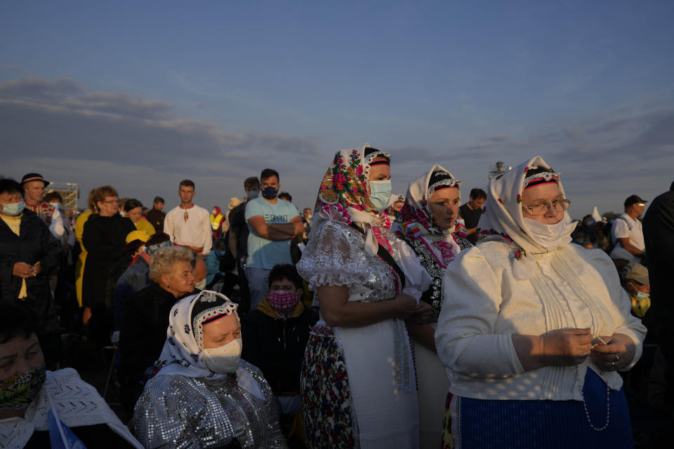 Faithful wait for Pope Francis' arrival in the esplanade of the National Shrine in Sastin, Slovakia, Wednesday, Sept. 15, 2021. Pope Francis is to hold an open air mass in Sastin near the Slovakian capital on Wednesday, the site of an annual pilgrimage each September 15 to venerate Slovakia's patron, Our Lady of Sorrows. (AP Photo/Petr David Josek)