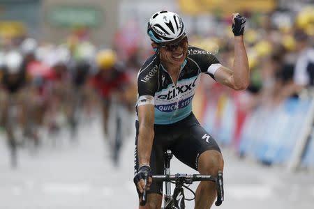 Etixx-Quick Step rider Tony Martin of Germany celebrates as he crosses the finish line to win the 223.5-km (138.9 miles) 4th stage of the 102nd Tour de France cycling race from Seraing in Belgium, to Cambrai, France, July 7, 2015. REUTERS/Benoit Tessier