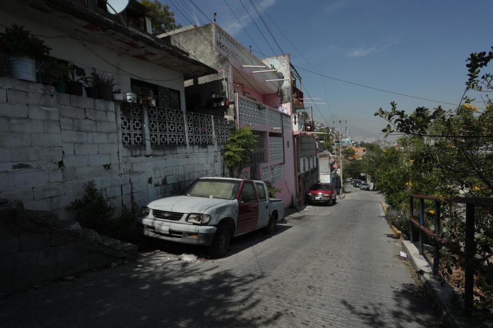 Cars parked on a hill