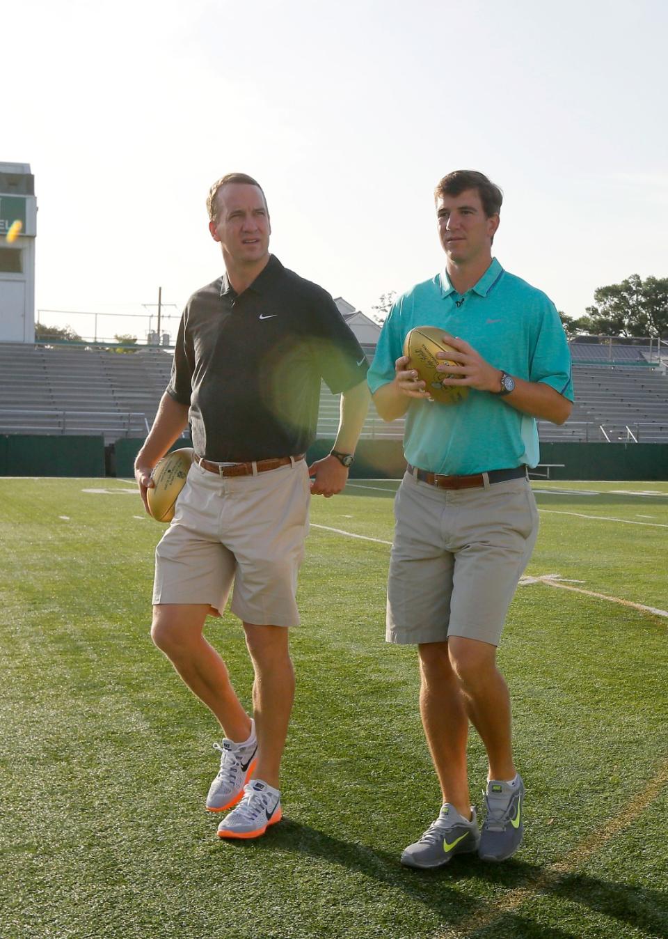 Peyton, left, and Eli Manning visit Newman School in New Orleans, their alma mater, in 2015