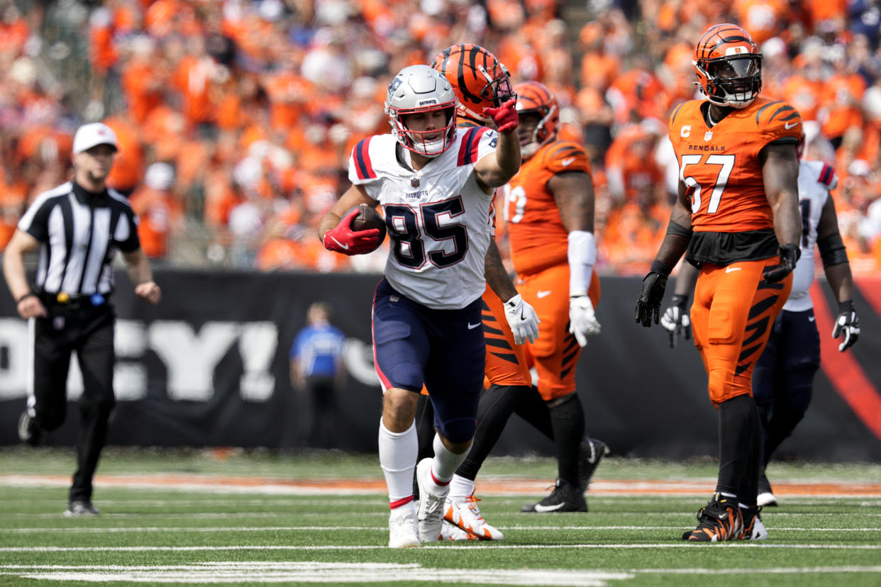 New England Patriots tight end Hunter Henry (85) celebrates in front of Cincinnati Bengals linebacker Germaine Pratt (57) after catching a pass for a first down during the second half of an NFL football game, Sunday, Sept. 8, 2024, in Cincinnati. (AP Photo/Jeff Dean)