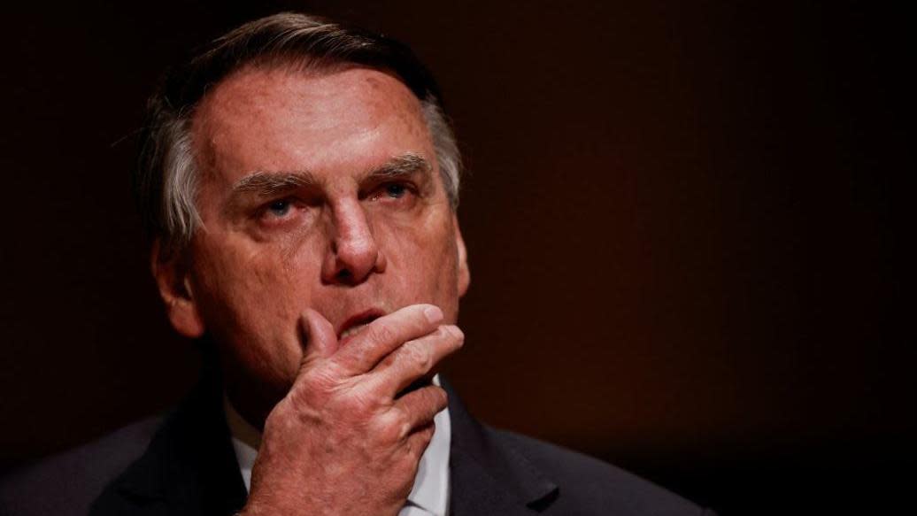 Jair Bolsonaro reacts at an event at the Municipal Theatre in Sao Paulo, Brazil, in March