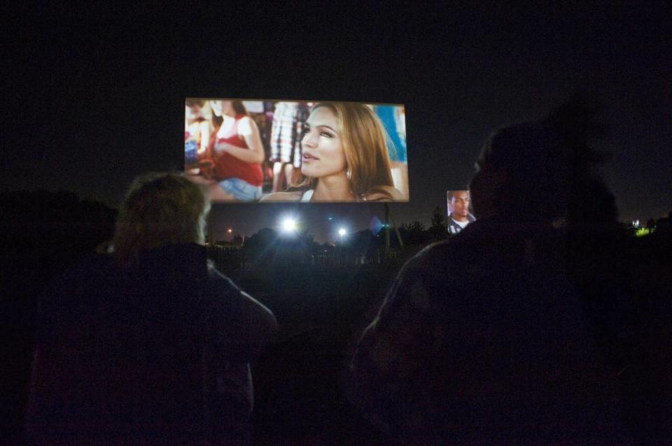 Betty Hay, left, along with her friend, Julie Zan enjoys an evening watching Piranha at Sacramento 6 Drive-In movie theaters, off Highway 50, which is an inexpensive entertainment option, Thursday, August 26, 2010.