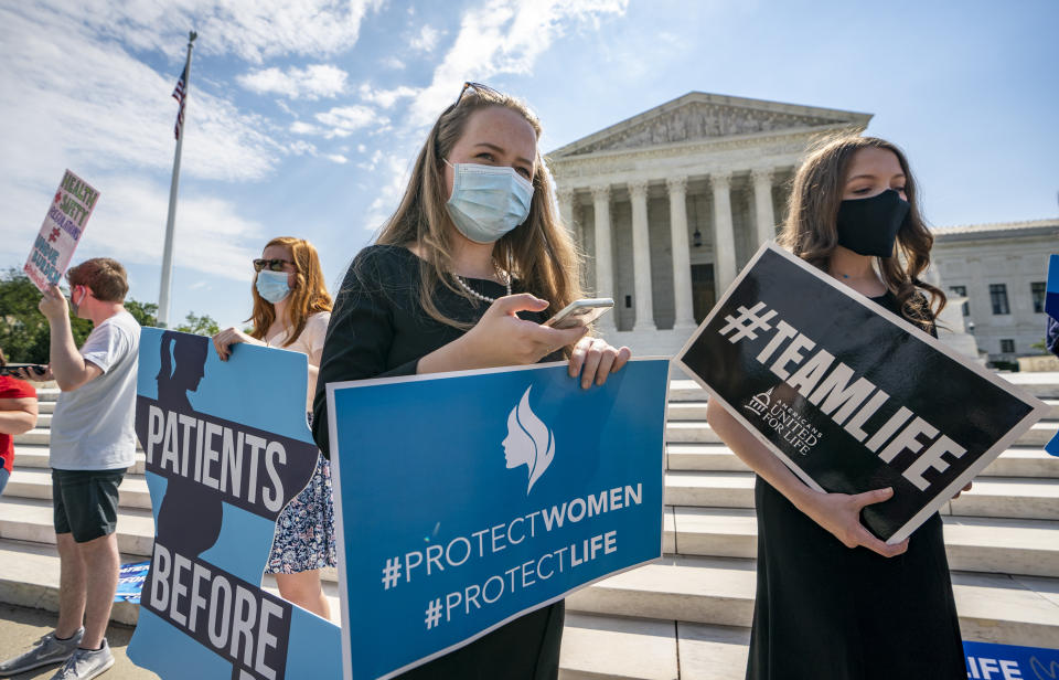 Anti-abortion activists wait in vain outside the Supreme Court for a decision, Thursday, June 25, 2020 in Washington. There was no announcement on the Louisiana case, Russo v. June Medical Services LLC. (AP Photo/J. Scott Applewhite)