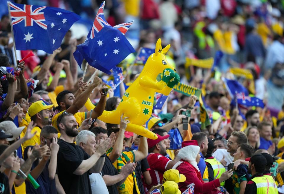 Australia's fans celebrate after winning the World Cup group D football match between Tunisia and Australia at the Al Janoub Stadium in Al Wakrah, Qatar, Saturday, Nov. 26, 2022. (AP Photo/Luca Bruno)