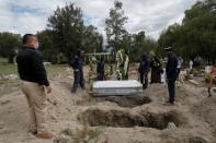 Family members say their last goodbyes to their relative who died of the coronavirus disease (COVID-19) in Mexico City