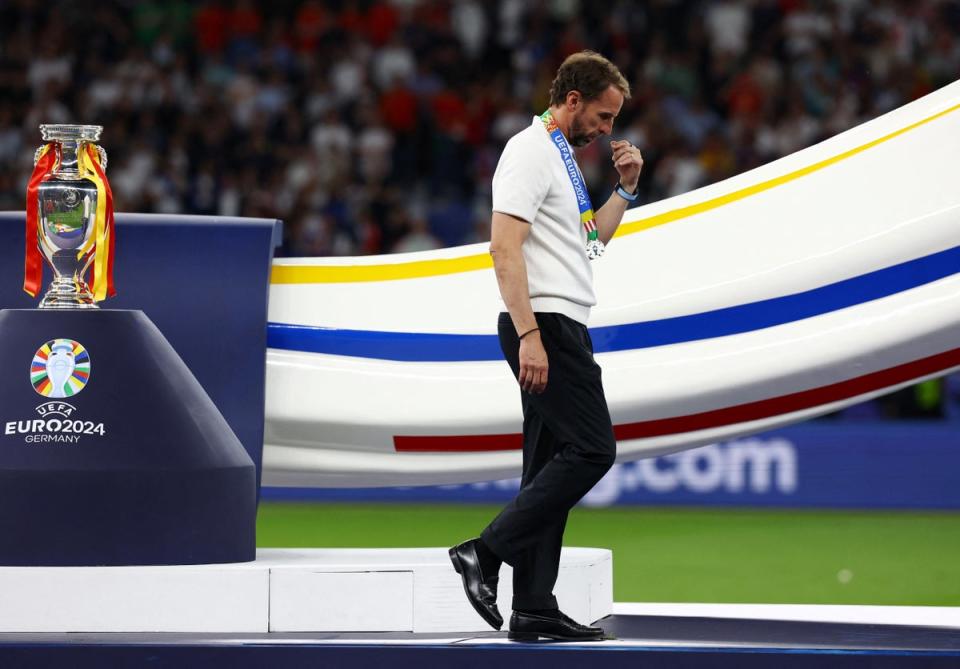 England manager Gareth Southgate looks dejected as he walks past the trophy (REUTERS)