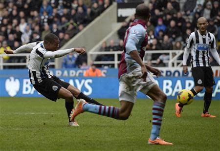 Newcastle United's Loic Remy (L) shoots to score against Aston Villa during their English Premier League soccer match at St James' Park in Newcastle, northern England, February 23, 2014. REUTERS/Nigel Roddis