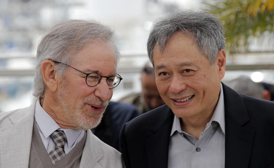 Jury president Steven Spielberg, left, speaks with jury member Ang Lee during a photo call for the jury at the 66th international film festival, in Cannes, southern France, Wednesday, May 15, 2013. (AP Photo/Lionel Cironneau)