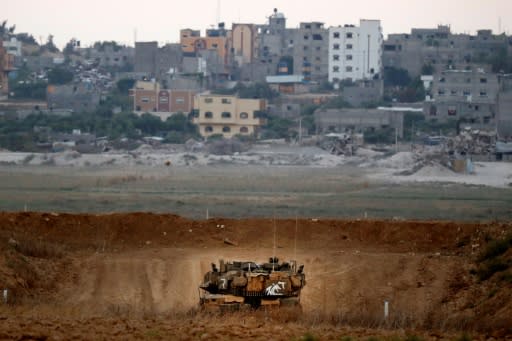 A picture taken on July 20, 2018 shows an Israeli Merkava tank patrolling along along the border with the Gaza Strip near the Kibbutz of Nahal Oz in southern Israel