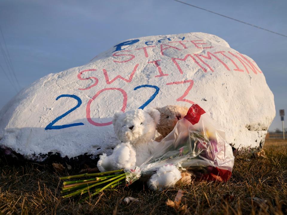 Teddy bears and flowers are seen outside of Perry High School following a shooting Thursday at the school, Friday, Jan. 5, 2024, in Perry, Iowa (AP)